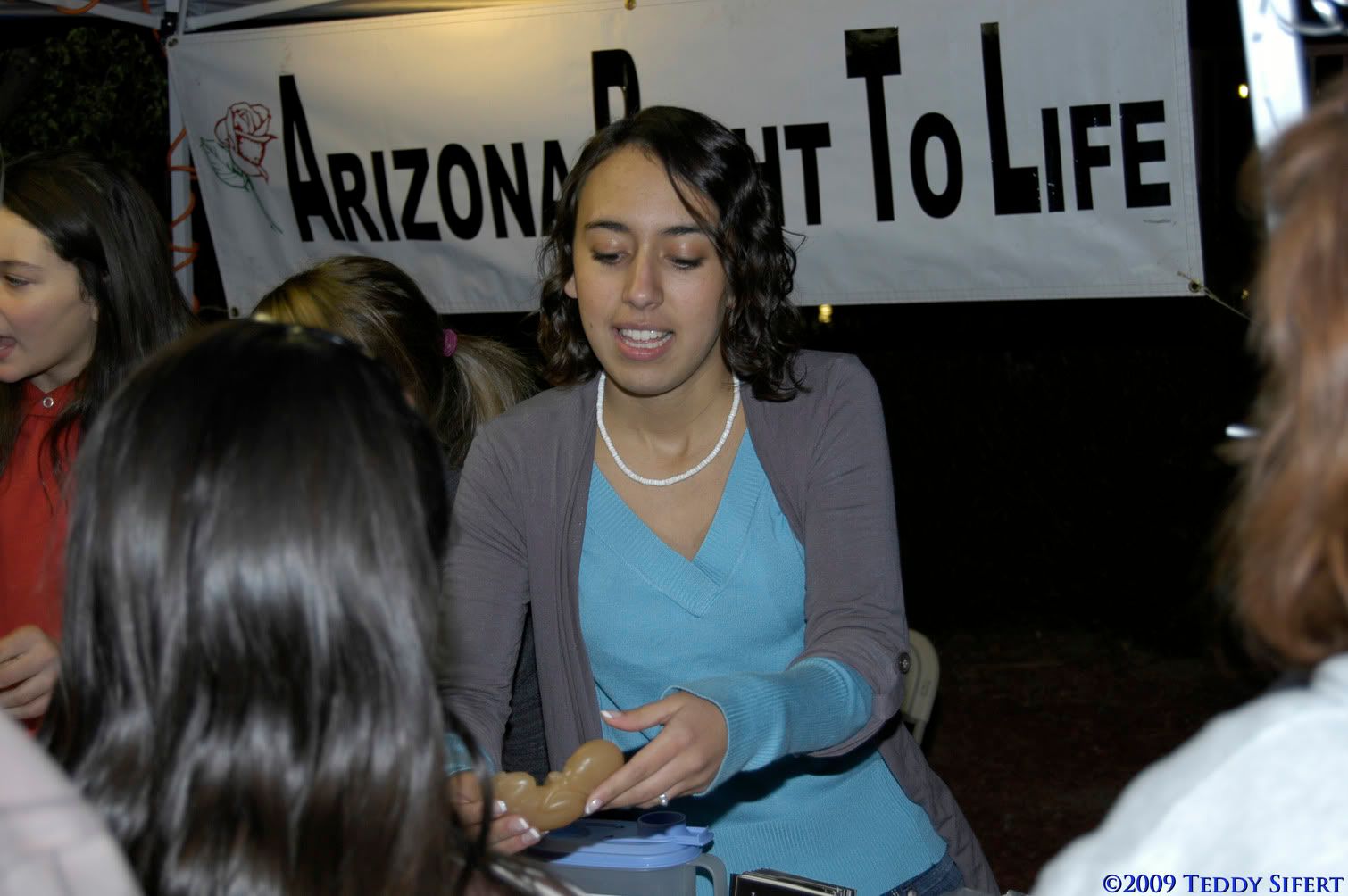 Photo: Teens for Life President Mary Patterson helps AZRTL educate the public at the GCU Fall Festival on Oct 30th, 2009